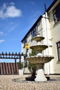 a large fountain in front of a building at Clifton Bridge Guesthouse in York