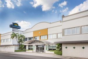 una representación de la parte delantera de un hotel en Days Inn by Wyndham Miami Airport North en Miami