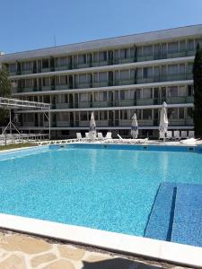 a large swimming pool in front of a building at Festa-Kranevo in Kranevo