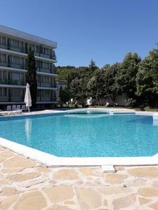 a large swimming pool in front of a building at Festa-Kranevo in Kranevo
