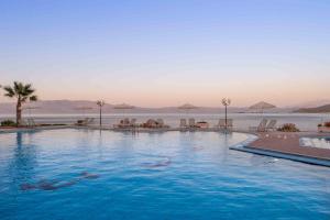 a large swimming pool next to a body of water at Balos Beach in Kissamos