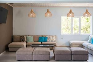a living room with a couch and a table at Balos Beach in Kissamos