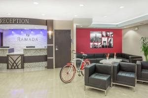 a bike parked in a lobby with a waiting room at Ramada by Wyndham Miami Springs/Miami International Airport in Miami +37 photos