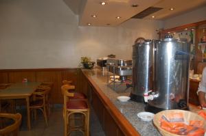 a restaurant with two fermentation tanks on the counter at Gran Hotel Vedra in Buenos Aires