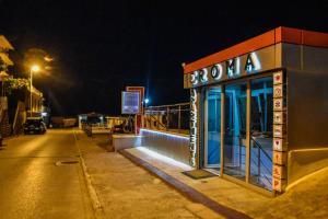 a building on the side of a street at night at Apartments Croma in Ulcinj