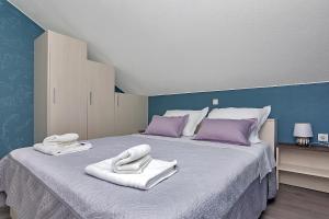 Postel nebo postele na pokoji v ubytování Apartments Beso