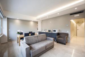 a living room with a couch and a table at B&B Tufilla in Ascoli Piceno