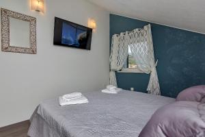 Postel nebo postele na pokoji v ubytování Apartments Beso