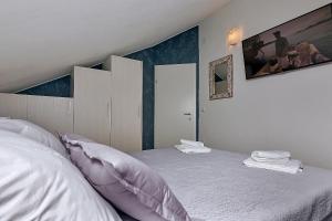 Postel nebo postele na pokoji v ubytování Apartments Beso