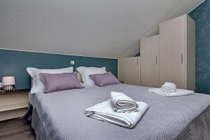Postel nebo postele na pokoji v ubytování Apartments Beso