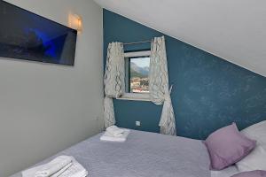 Postel nebo postele na pokoji v ubytování Apartments Beso