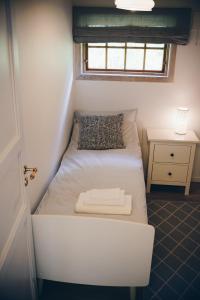 Tempat tidur dalam kamar di Dalhus - House in the Valley