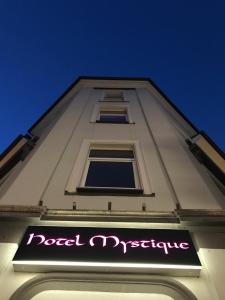 a building with a sign that reads road tripping at SmartHotel Mystique Self check-in in Bad Homburg vor der Höhe