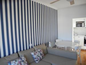 a living room with a couch and a table at Apartamentos Colombia Ap 5 in Puerto del Carmen