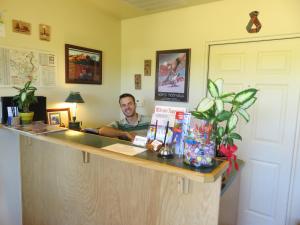 a man sitting at a counter in a room at Sedona Village Lodge in Sedona