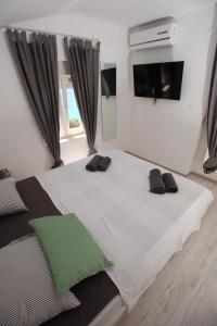 Postel nebo postele na pokoji v ubytování Apartment Smokva ****