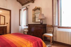 מיטה או מיטות בחדר ב-Serenissima