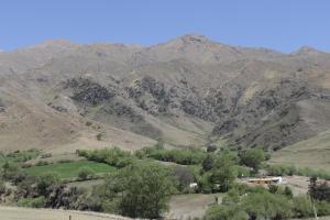 a mountain range with trees and mountains in the background at Villa Rural San Miguel de la Loma in Tafí del Valle +43 photos