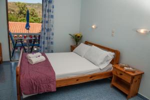 Ένα ή περισσότερα κρεβάτια σε δωμάτιο στο Dina Studios  +42 φωτογραφίες