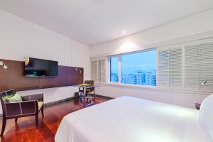 Ένα ή περισσότερα κρεβάτια σε δωμάτιο στο Hotel Spiwak Chipichape Cali