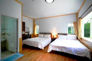 Postel nebo postele na pokoji v ubytování Winlu Vacation Farm