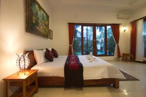Postel nebo postele na pokoji v ubytování Uma Loris Ubud + 37 fotografií