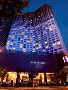 a new world building with the words new world on it at New World Dalian Hotel in Dalian