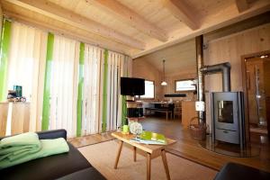 a living room with a couch and a table at Ferienhof Weltenburg in Kelheim