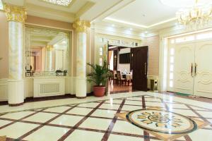 a large room with a lobby with a large mirror at Rakat Plaza in Tashkent