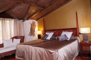 Postel nebo postele na pokoji v ubytování Hotel & Spa Sierra de Cazorla 4*