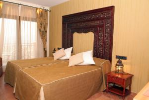 Postel nebo postele na pokoji v ubytování Hotel & Spa Sierra de Cazorla 4*