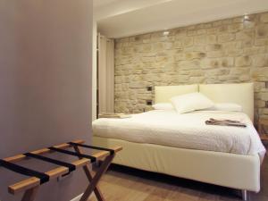 Postel nebo postele na pokoji v ubytování Olivia Rooms Eurialo