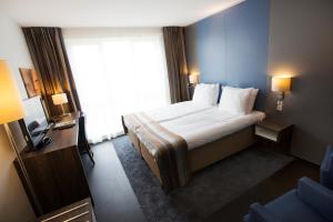 Postel nebo postele na pokoji v ubytování City Hotel Gouda, WorldHotels Crafted Collection