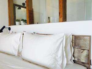 Una cama o camas en una habitación de il Piccolo Polpo Hotel
