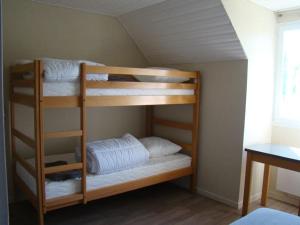 two bunk beds in a room with a window at Orient Village in Géraudot