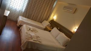 Postel nebo postele na pokoji v ubytování Hotel Berlin
