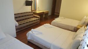 Postel nebo postele na pokoji v ubytování Hotel Berlin