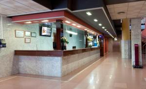 a fast food restaurant with a counter in a building at Hotel Cabana in Benidorm