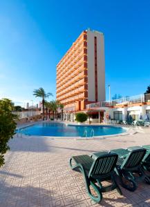 a hotel with a swimming pool in front of a building at Hotel Cabana in Benidorm