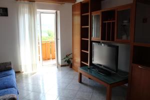 TV a/nebo společenská místnost v ubytování Appartamento Widmann