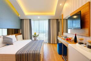 Postel nebo postele na pokoji v ubytování Dosinia Luxury Resort-Ultra All Inclusive