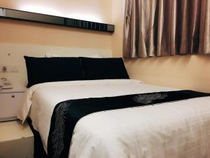 Katil atau katil-katil dalam bilik di Seasons Hotel - Causeway Bay