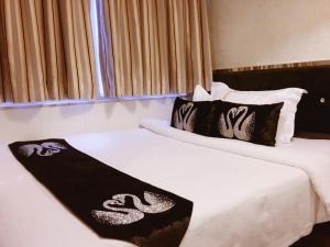 Katil atau katil-katil dalam bilik di Seasons Hotel - Causeway Bay