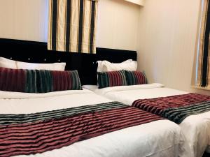 Katil atau katil-katil dalam bilik di Seasons Hotel - Causeway Bay