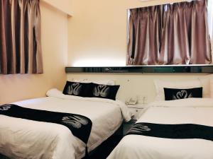Katil atau katil-katil dalam bilik di Seasons Hotel - Causeway Bay