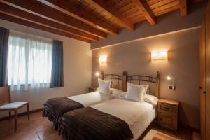 Cama o camas de una habitación en Hotel-Apartamento Rural Atxurra