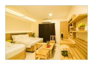 Postel nebo postele na pokoji v ubytování Hotel Ashoka