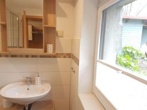 Koupelna v ubytování Ferienwohnung Tannenweg / Poseritz + 15 fotografií