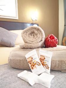 a hotel room with a bed with a towel and a towel at Travel Lodge Sabie in Sabie