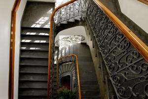 a flight of stairs with wrought iron railings at Abdij Hotel Rolduc in Kerkrade